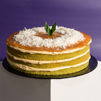 The Locale pandan gula melaka cake, whole, topped with gula melaka glaze and shredded coconut — Elevete Patisserie