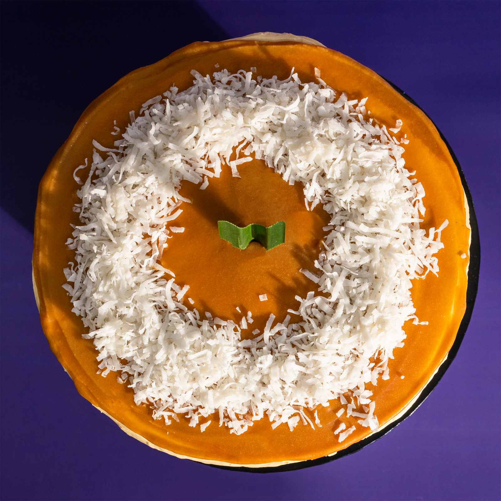 The Locale pandan gula melaka cake from above, coconut-topped — Elevete Patisserie