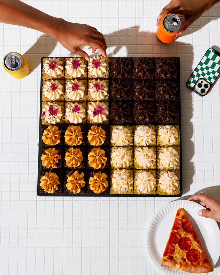 Overhead view of Elevete Patisserie Mix and Match Cake Bites tray with four assorted flavours including chocolate, pandan, salted caramel and lemon poppy seed, halal certified Kuala Lumpur & selangor